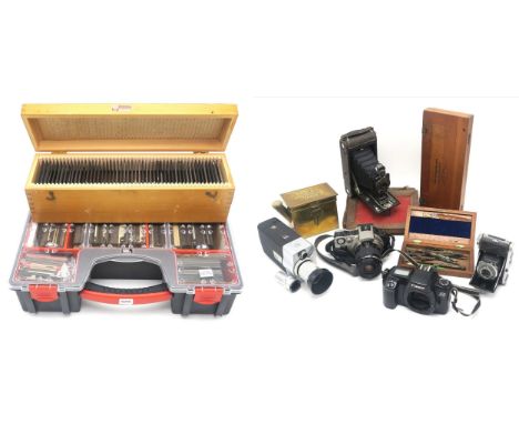 Cameras and related equipment, to include a Canon Eos IX camera fitted with an EF 35-80mm Zoom lens, a brass Dallan Developin