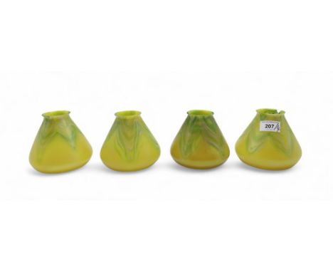 Four Loetz glass light shades in yellow and green with opalescent lustre Condition Report:one chipped and cracked, others hav