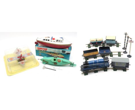 A tinplate clockwork Nautilus submarine by Sutcliffe models, a boxed Jupiter Ocean Pilot Cruiser clockwork boat, a Chad Valle