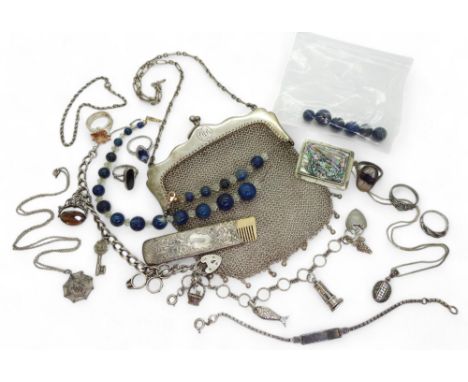 A silver mesh handbag, a silver cased comb (comb..plastic) two silver charm bracelets with attached silver and white metal ch