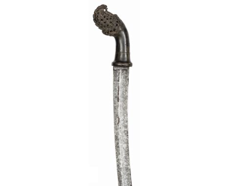 A 19th century Malayan klewang,  curved shallow fullered European blade 29½”, nicely carved, darkwood hilt of traditional for