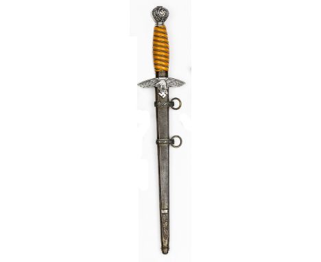 A similar Luftwaffe officer’s dagger, by Eickhorn, with orange grip, the pommel swastikas retaining faint traces of gilt, in 