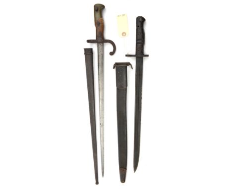 A Gras bayonet, d. 1876 on backstrap, in scabbard (some dark rust) and a 1917 Remington bayonet, in scabbard. GC (2)         