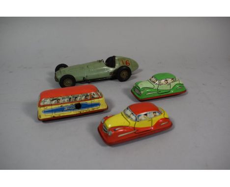 A Collection of Vintage Tin Plate Clockwork Toy Cars and Buses and a Wooden Toy Racing Car 