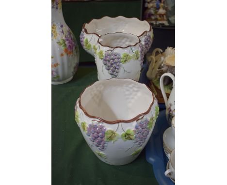 A Collection of Three Portuguese Ceramic Bowls and Vases Decorated in Relief with Bunches of Grapes 