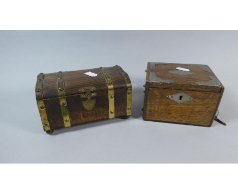 A Brass Mounted Wooden Tea Caddy in the Form of a Travelling Trunk Together with a Metal Mounted Oak Money Box with Key 