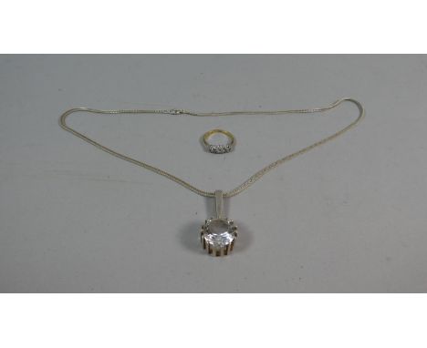 A Ladies Dress Ring and Necklace with Solitaire White Stone 