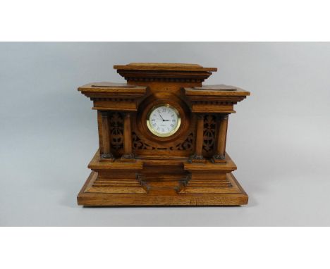 A Carved Wooden Mantle Clock of Architectural Form with Replacement Quartz Movement, 30.5cm Wide 