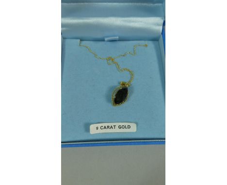 A 9ct Gold Chain with Smoky Quartz Pendant 