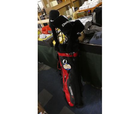 A Paragon Golf Bag Containing Dunlop Irons and Woods 