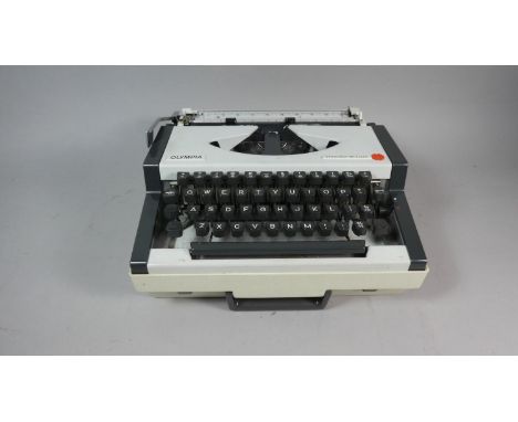 A Vintage Olympia Traveller Deluxe Manual Portable Typewriter 