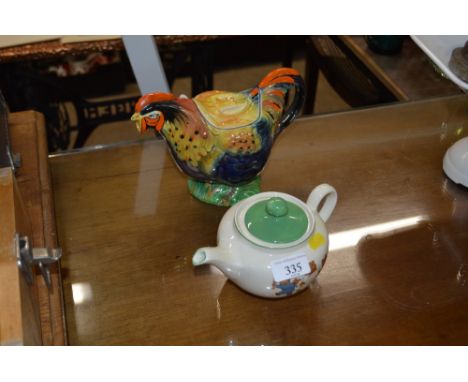 A novelty teapot in the form of a Rooster; together with a Ridgway teapot depicting Teddy Bears bedtime