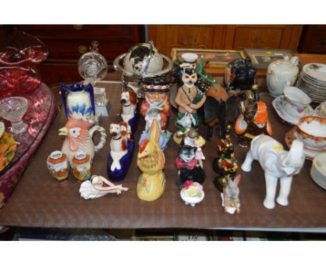 A quantity of various ornaments to include Staffordshire style greyhounds, elephant ornaments, Goebel figurine etc. 
