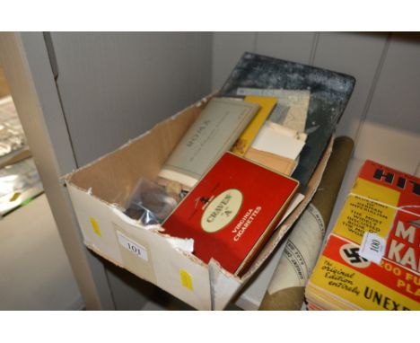 A box containing various coinage, loose stamps, post-cards etc. 