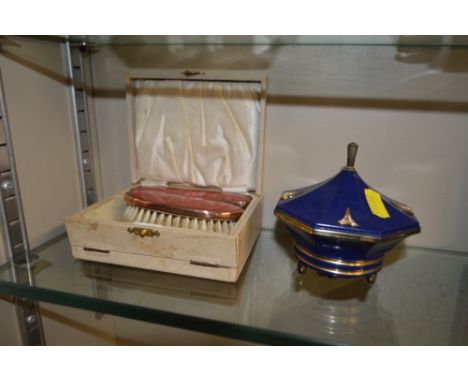 An enamel brush set; together with a musical powder compact 