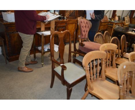 A pair of Queen Anne style carver chairs; and a Victorian mahogany button back chair 