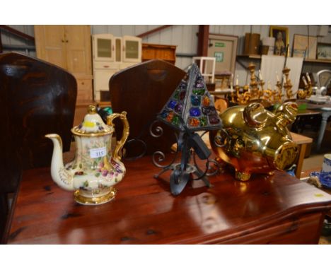 A metal lamp; together with a coffee pot and a piggy bank