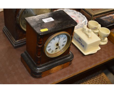 A mahogany cased single hole mantel clock with presentation plaque