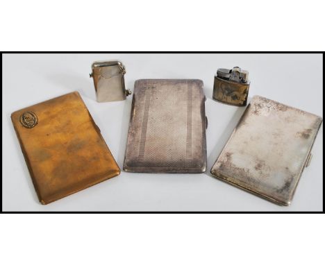 A group of vintage smoking items to include a Thorens Lighter, another lighter stamped Omega featuring nude women, two engine