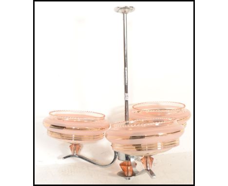 A retro mid 20th Century three point angular / atomic chrome chandelier / light fixture in the modernist style