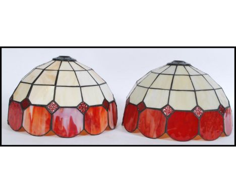 A pair of 20th Century Tiffany style stained glass ceiling / light fixture shades.