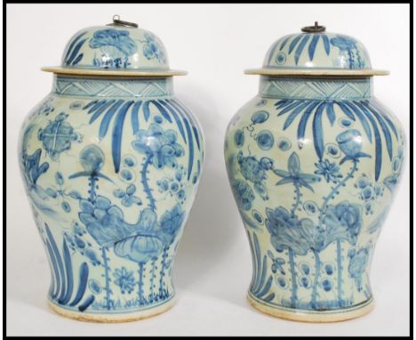 A pair Chinese blue and white large tall lidded vases having hand painted decorated with underwater scenes of carp and foliag