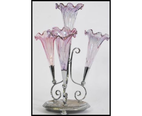 A 19th century Victorian glass and silver plated epergne centre piece, having a central trumpet with a frilled rim and pearle