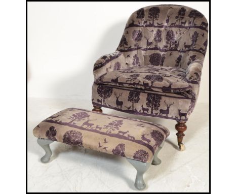 A late 19th century Victorian tub chair on turned wooden feet with ceramic casters having a button backed chesterfield style 