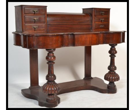 A Victorian 19th century mahogany duchess dressing table with upright trinket drawers having shaped base with further drawers