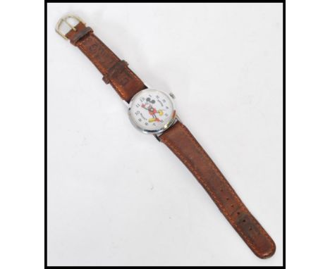 A vintage Disney Mickey Mouse Automaton watch by Bradley featuring the iconic character with moving arms. Set to a vintage br