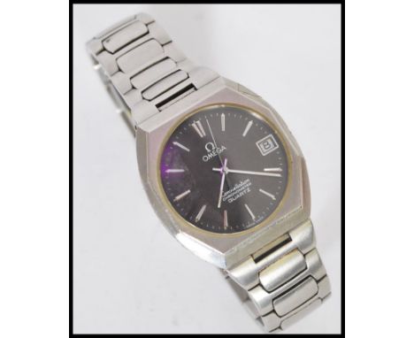 An Omega Constellation Chronometer Quartz movement stainless steel watch having a black dial with silver baton numerals and f