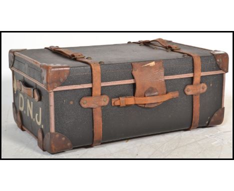 A stunning early 20th Century canvas and cane bound ebonised steamer trunk, retaining all the original leather straps in good