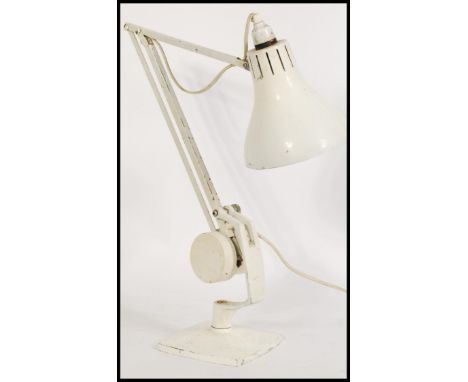 A vintage retro 20th century industrial Hadrill Horstmann desk lamp raised on a square base with adjustable counter balance a