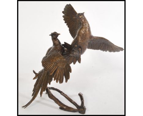 A bronze figurine sculpture of a pair of fighting grouse by Michael Simpson, stamped to the base MS, limited edition number 4