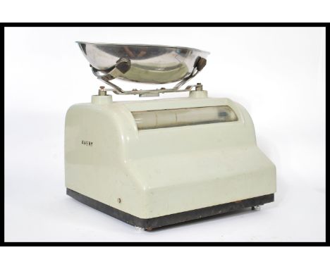 A set of vintage retro 20th century Industrial Avery weighing grocers scales having a lime enamel finish with chrome weighing