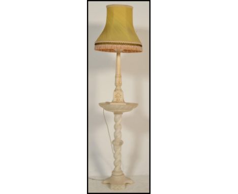 A mid century alabaster plant stand having barley twist shaped column together with a matched resin cast table lamp with shad