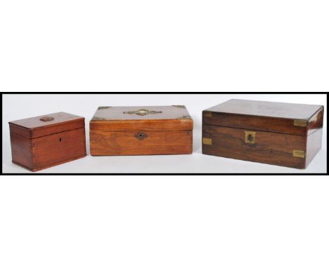A 19th century Georgian walnut and brass bound writing slope having appointed interior set within together with a&nbsp;&nbsp;