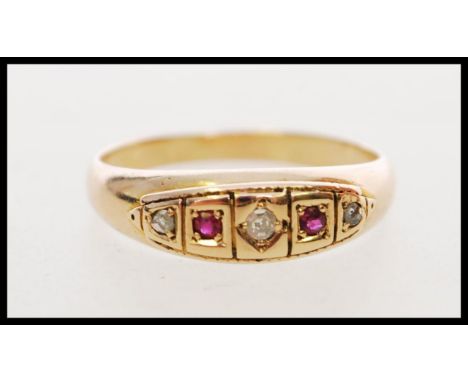 A hallmarked 19th century Victorian 15ct gold ring set with red stones, a white sapphire, a rose cut diamond. Hallmarked Ches