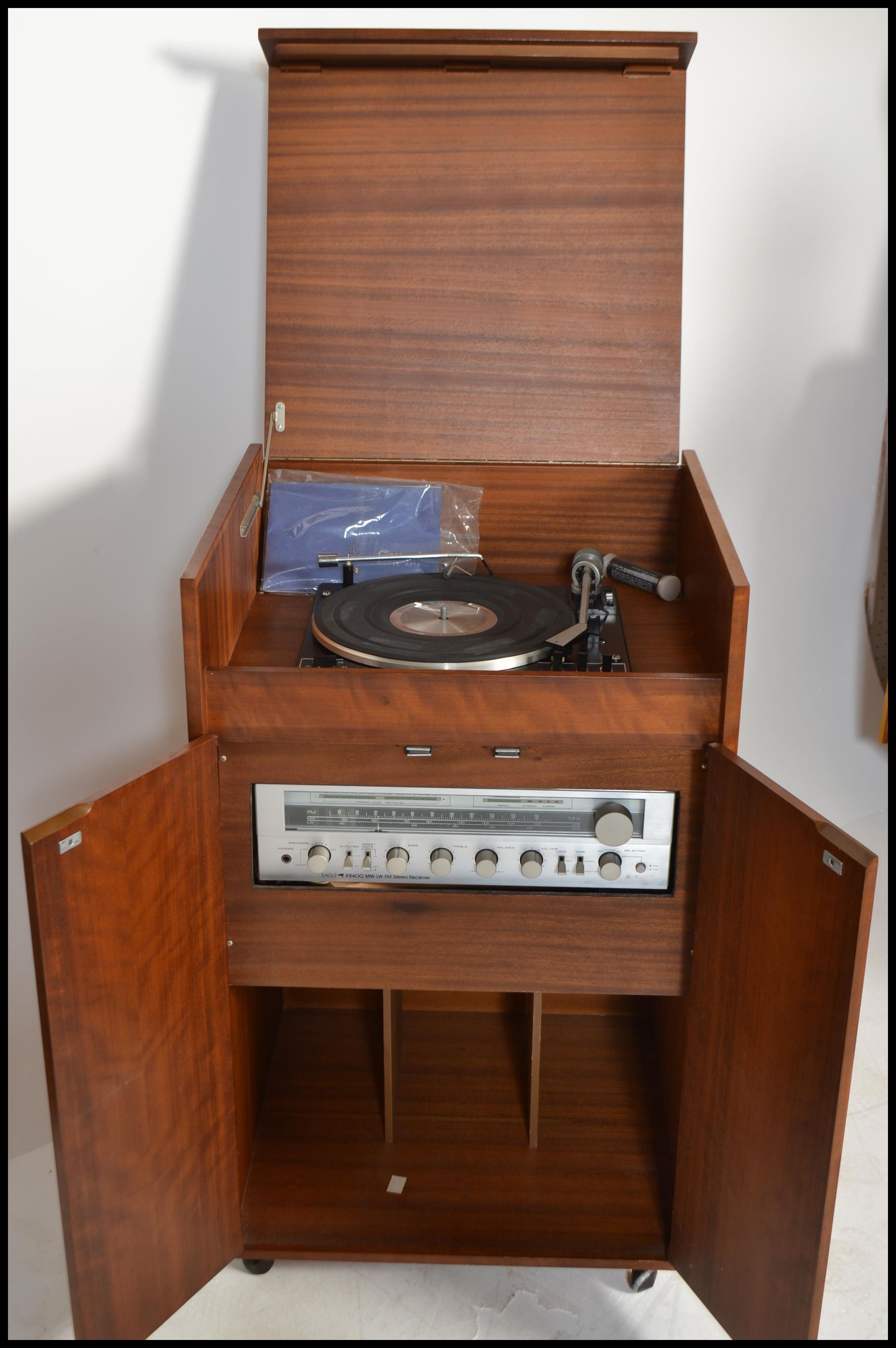 A vintage 20th century teak cased record player music having a