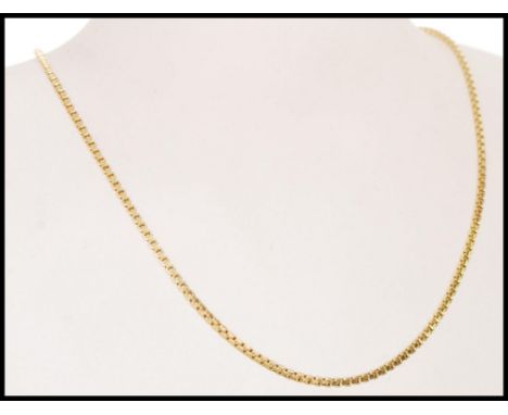 A 20th century stamped 9ct gold box chain necklace with a spring ring clasp, item weighs 5.4g. Measures 41 cm long.