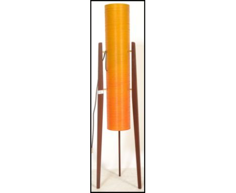 A retro 1960's rocket lamp, floor standing teak and spun resin, the cream cylindrical centre flanked by three worked timber s