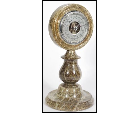 A 20th century grey marble British made desktop/ table Shortland barometer, having a round face with two faceted hands and a 