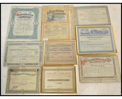 A collection of vintage mounted and glazed share certificates dating from 1913 to include Societe Anonyme des Cargos Francais