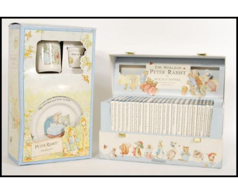 A group of 20th century Beatrix potter items to include a book set and a Wedgwood ceramic set. Book set measures 15cm-high 30