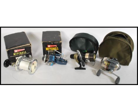 A collection of fishing reels to include a Garcia Mitchell Model 624, Garcia Mitchell Match, Shakespeare TI 20 Titanium, Shim