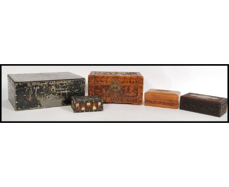 A selection of wooden boxes to include a trinket box with inlaid porcupine quills having a sliding lid, a hinged and carved w