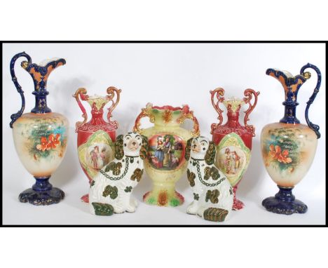 A collection of 19th century Victorian Staffordshire ceramics to include a pair of pink ceramic portrait vases with scrolled 