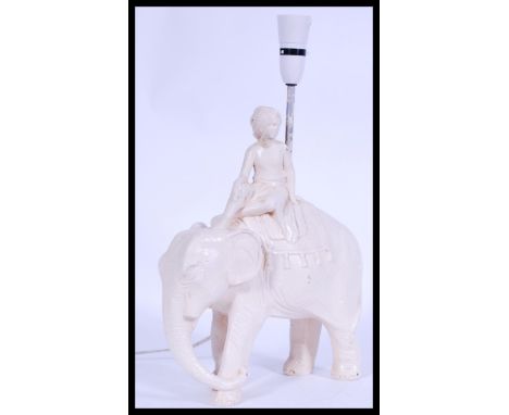 A vintage 20th century retro chalk ware lamp in the form of an elephant and rider, please see images.&nbsp;Measures: 46 cm hi