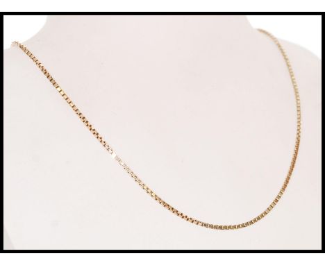 A stamped 9ct gold box chain necklace with a spring ring clasp, item weighs 6.5g. Measures 42 cm long.