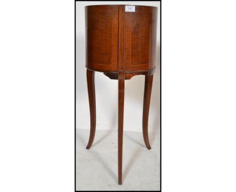 An early 20th century Edwardian Jardiniere planter raised on splayed tripod legs with boxwood inlay details.